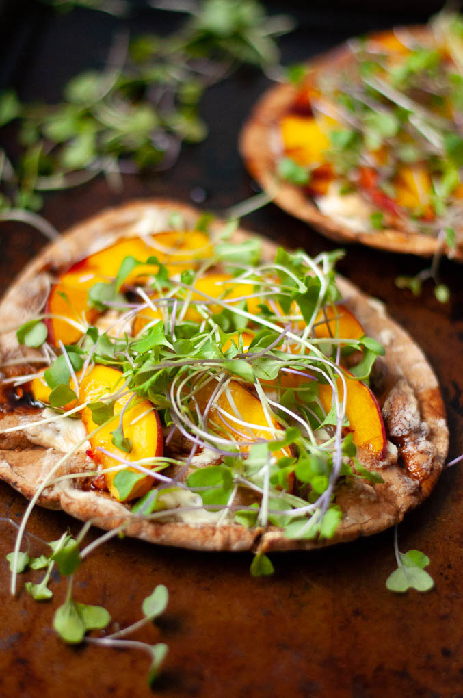 Close up of microgreens on pizza.