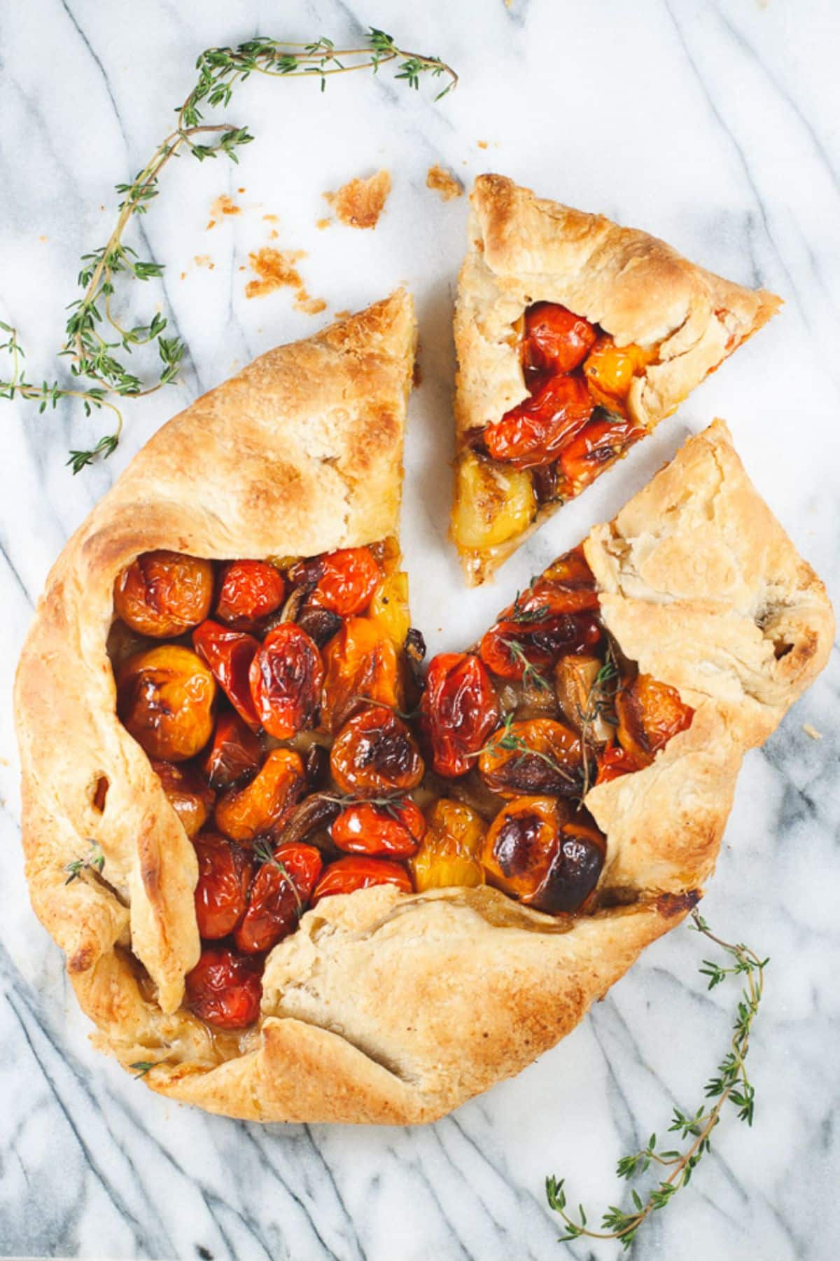 Cherry tomato galette with one slice removed.
