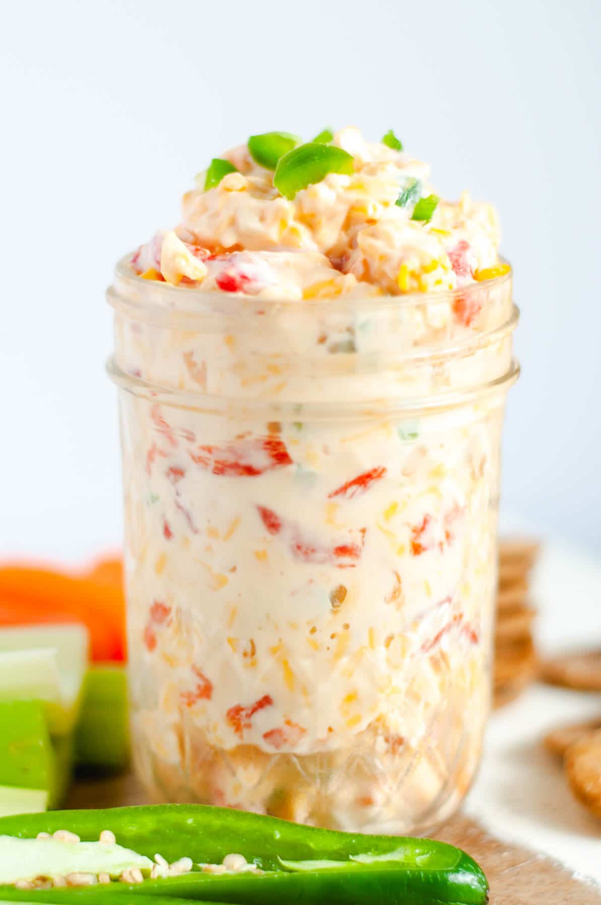 Side view of pint sized glass ball jar filled to the top with pimento cheese