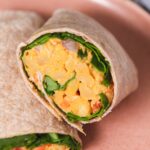 Close up of curry chickpeas in a wrap.