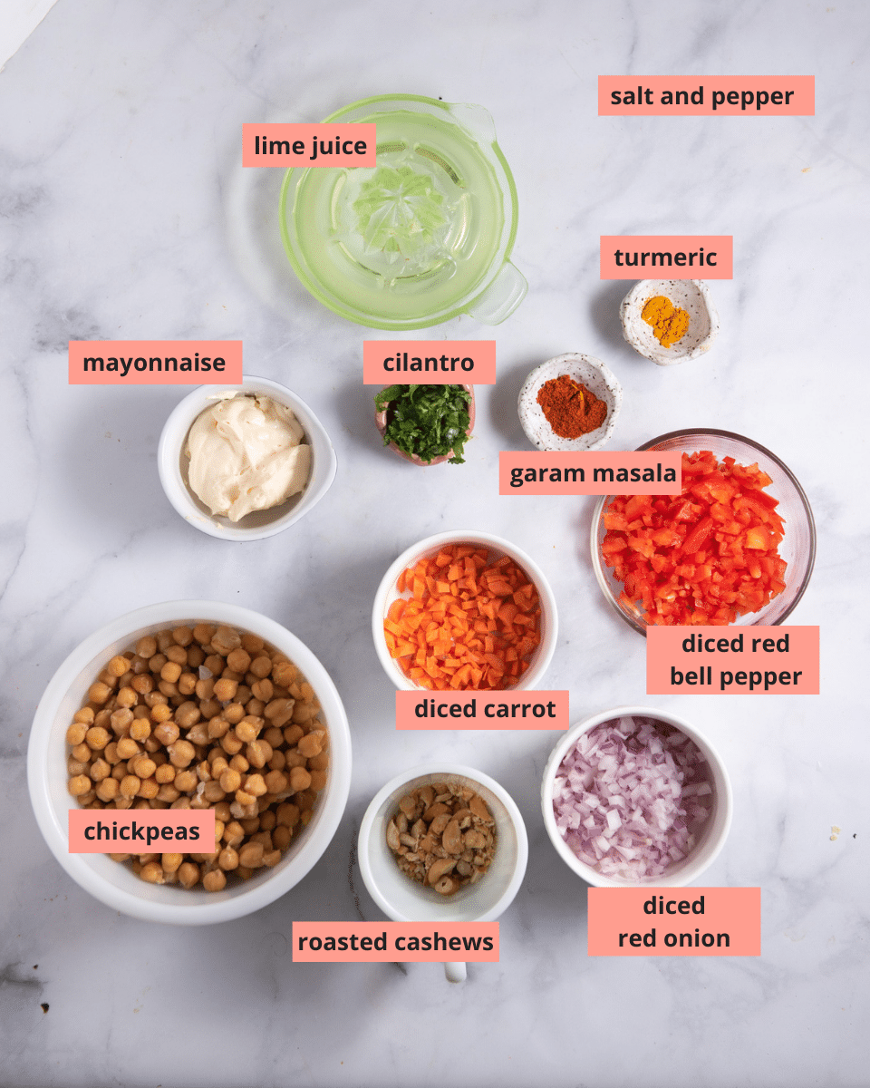 Ingredients in separate bowls on a marble background.