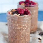 Two glass pint jars filled with mocha overnight oats.