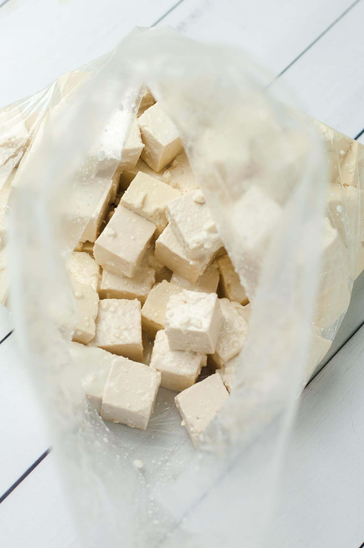 Tofu cubes in a plastic bag.