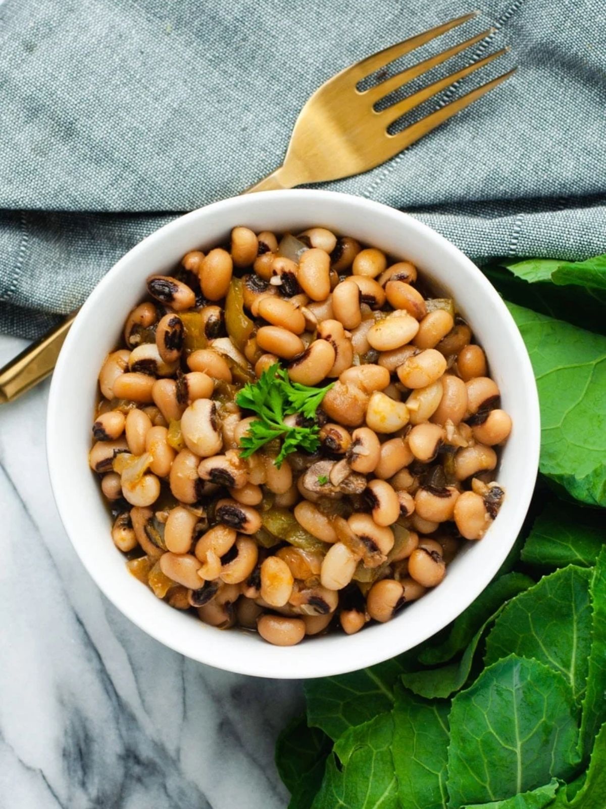 White bowl filled with black eyed peas.
