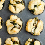 Cooked puff pastry appetizers in a muffin tin
