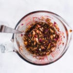 Marinade ingredients in a glass measuring cup