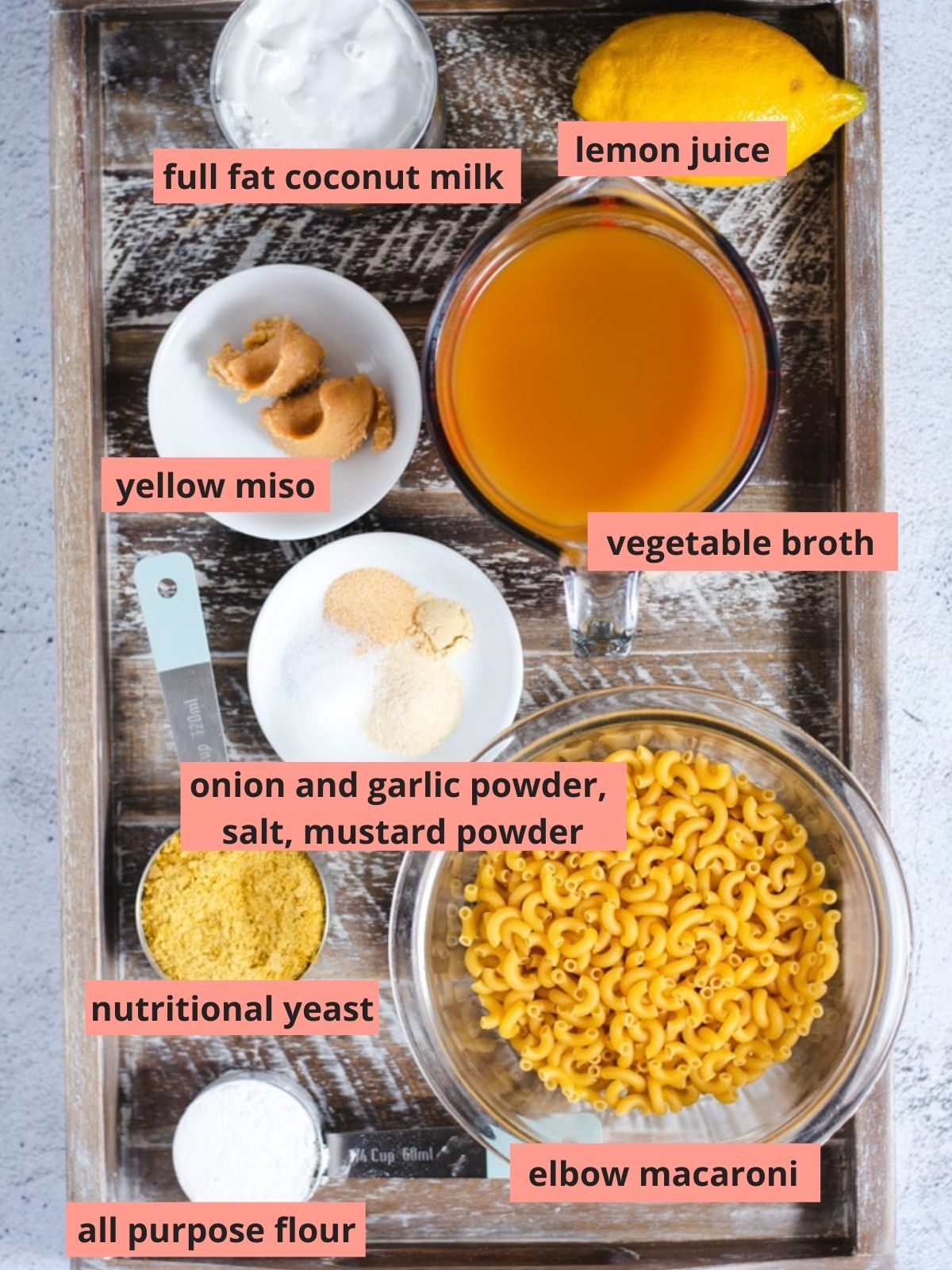 Labeled ingredients used to make vegan mac and cheese.