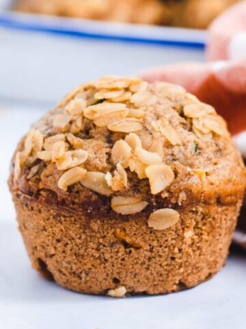 Close up of texture of oat topped muffin.