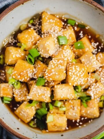 Sesame tofu in a gray bowl.