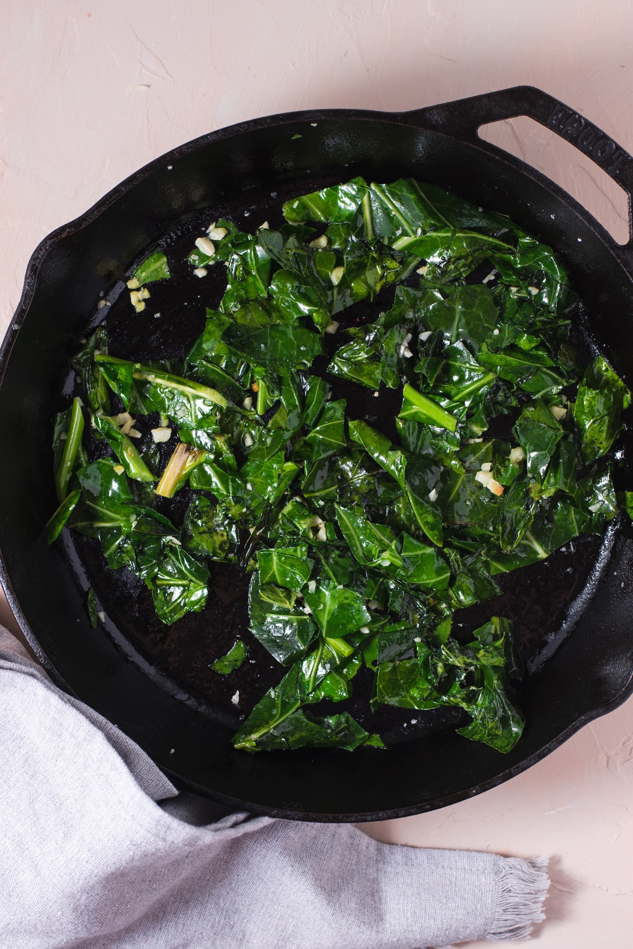 Wilted collard greens in cast iron pan