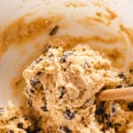 Chocolate chip cookie dough in mixing bowl