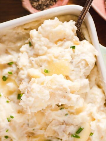 Mashed potatoes topped with butter and chives