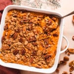 Overhead view of white squash casserole dish filled with sweet potato casserole
