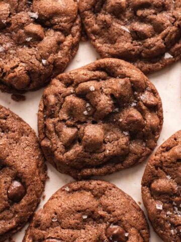 Overhead view of brown cookies on white background