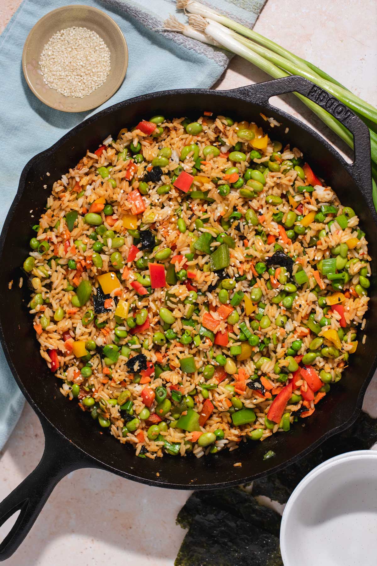 Fried rice with vegetables in a cast iron skillet