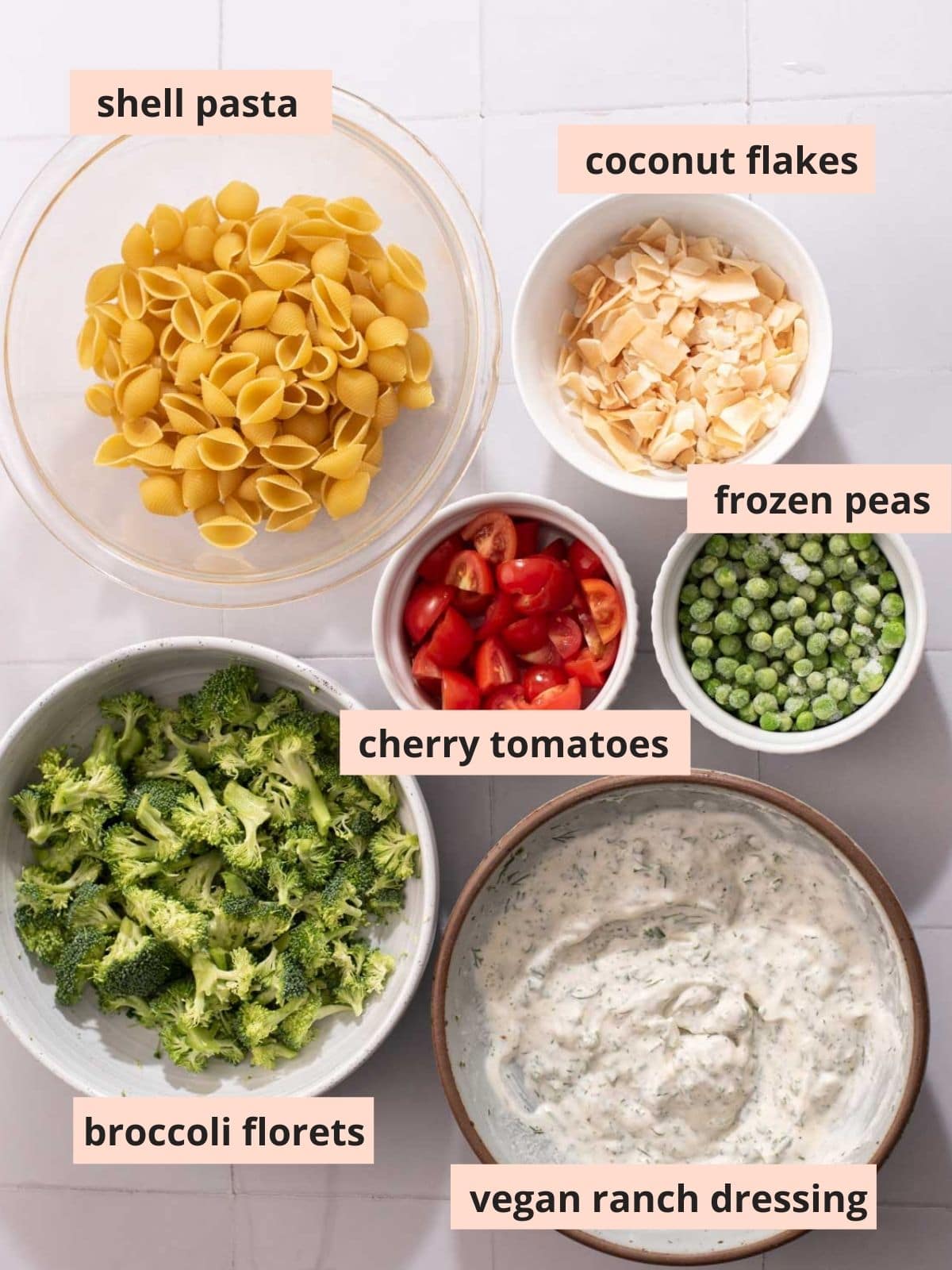 Labeled ingredients to make pasta salad.