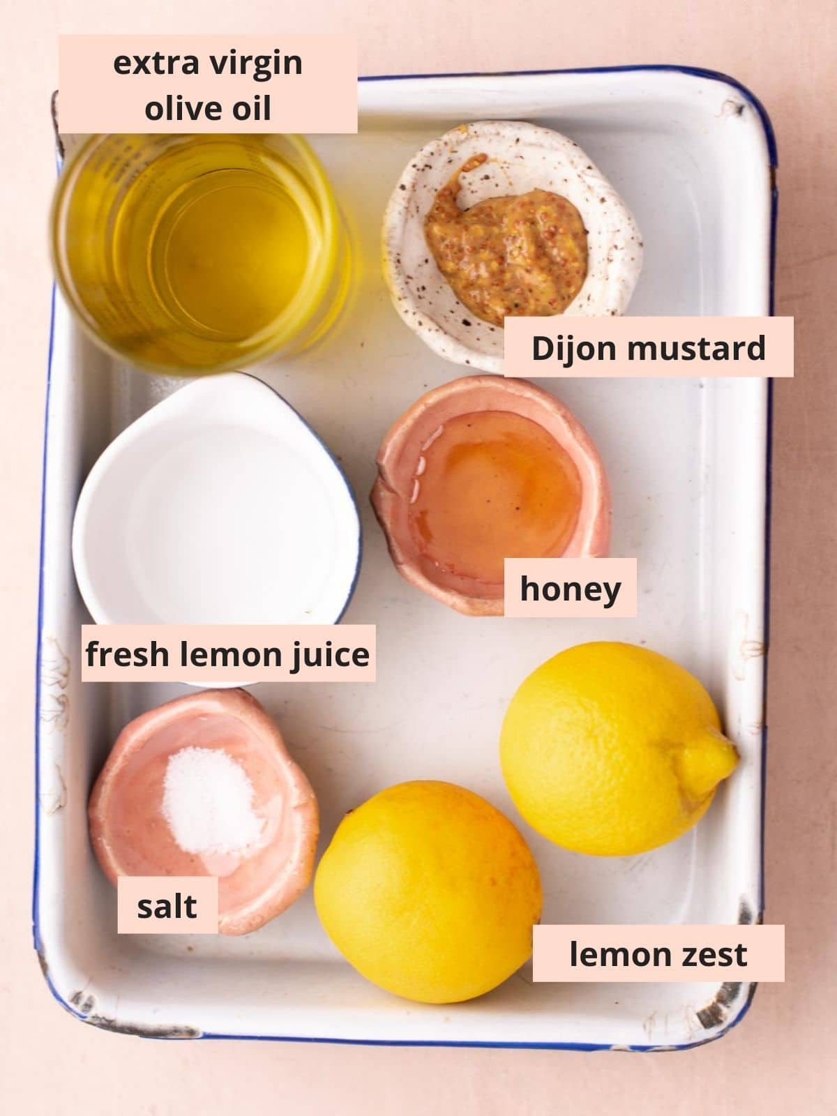 Labeled ingredients used to make lemon vinaigrette.