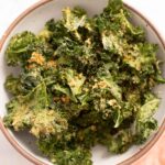 Nutritional yeast kale chips in a bowl.