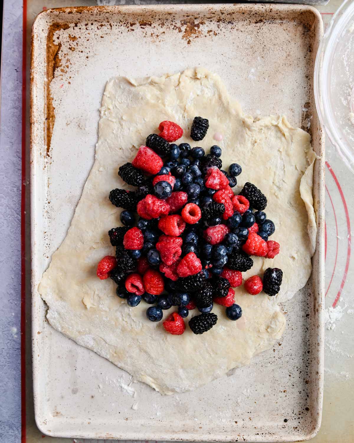 Berries in the center of galette dough.