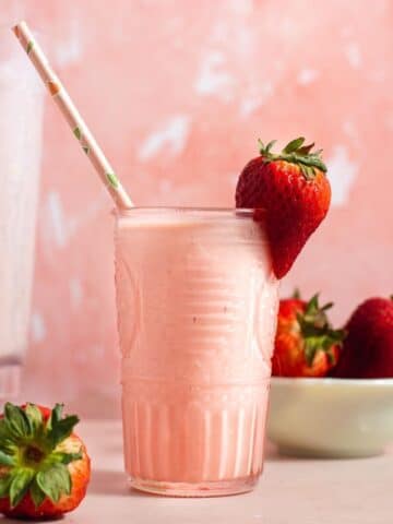 Pink glass filled with a pink smoothie.