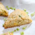 Side view of flaky layers of cheddar scallion scone.