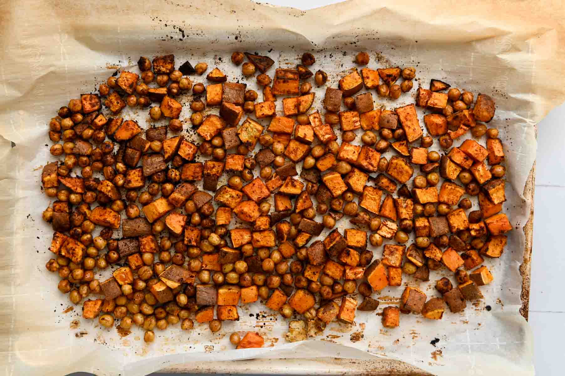 Cubed sweet potato and chickpeas after roasting.