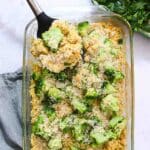 Overhead view of rectangular casserole dish filled with broccoli and rice.