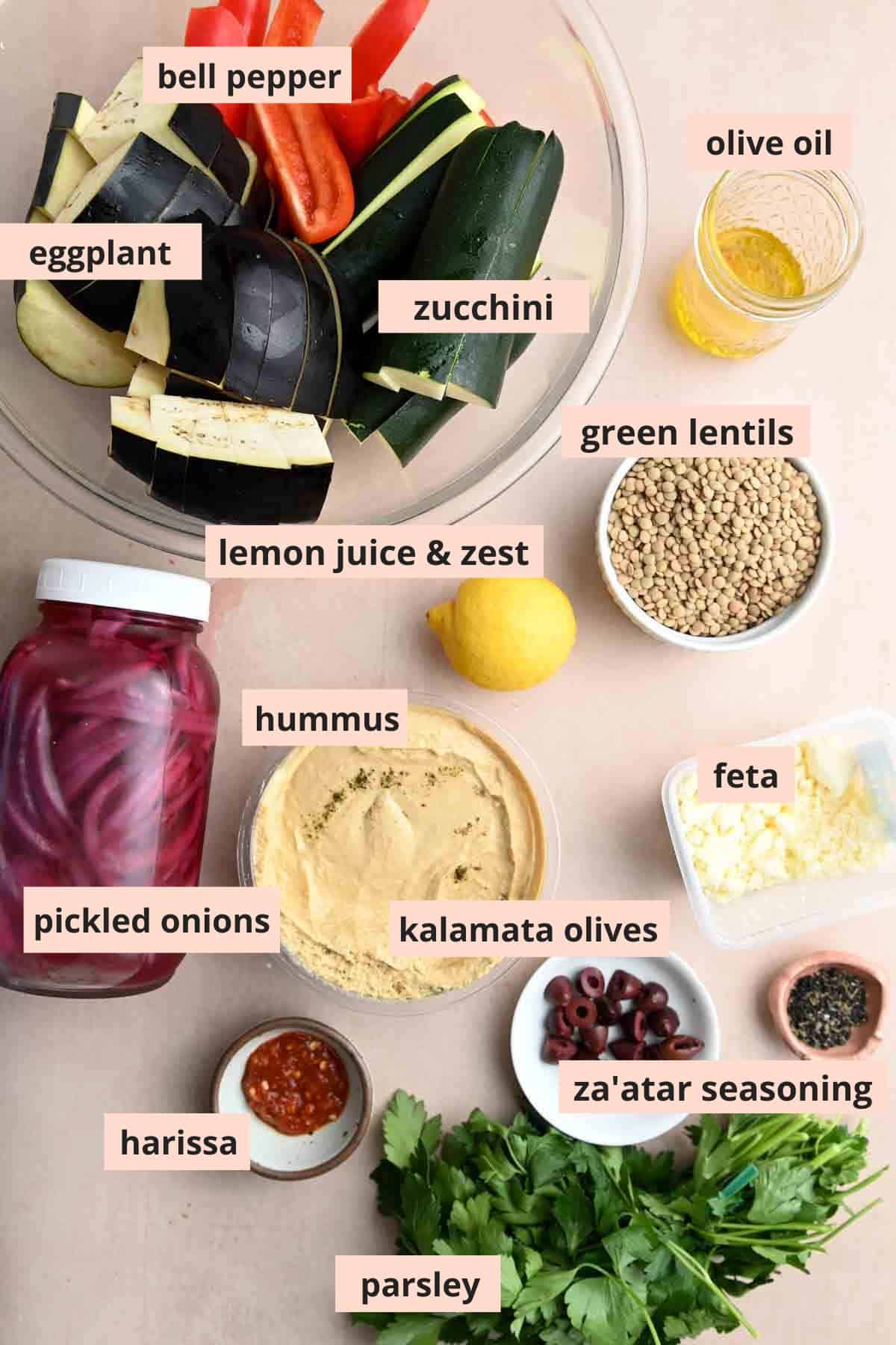 Labeled ingredients used to make hummus bowls.