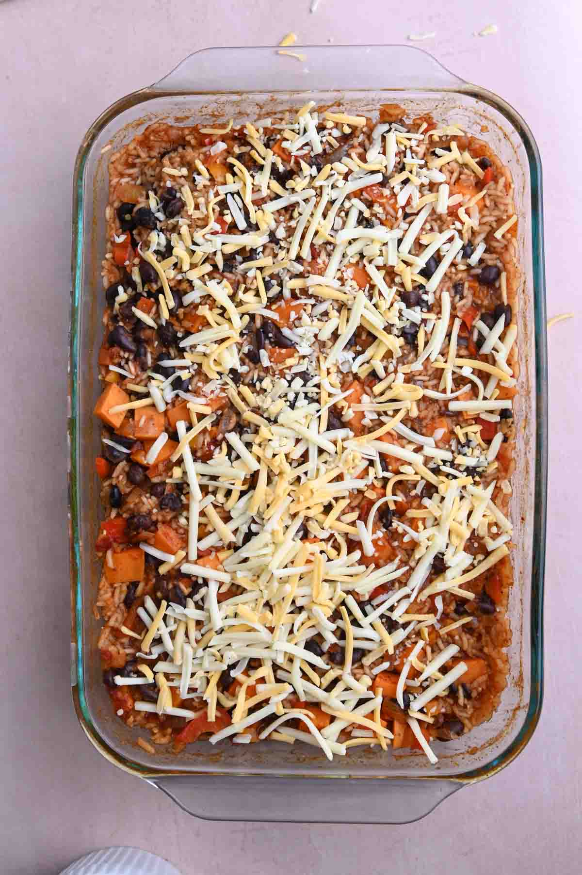 Rice and bean bake topped with shredded cheese.