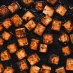 Close up of cubed pan-fried tofu.