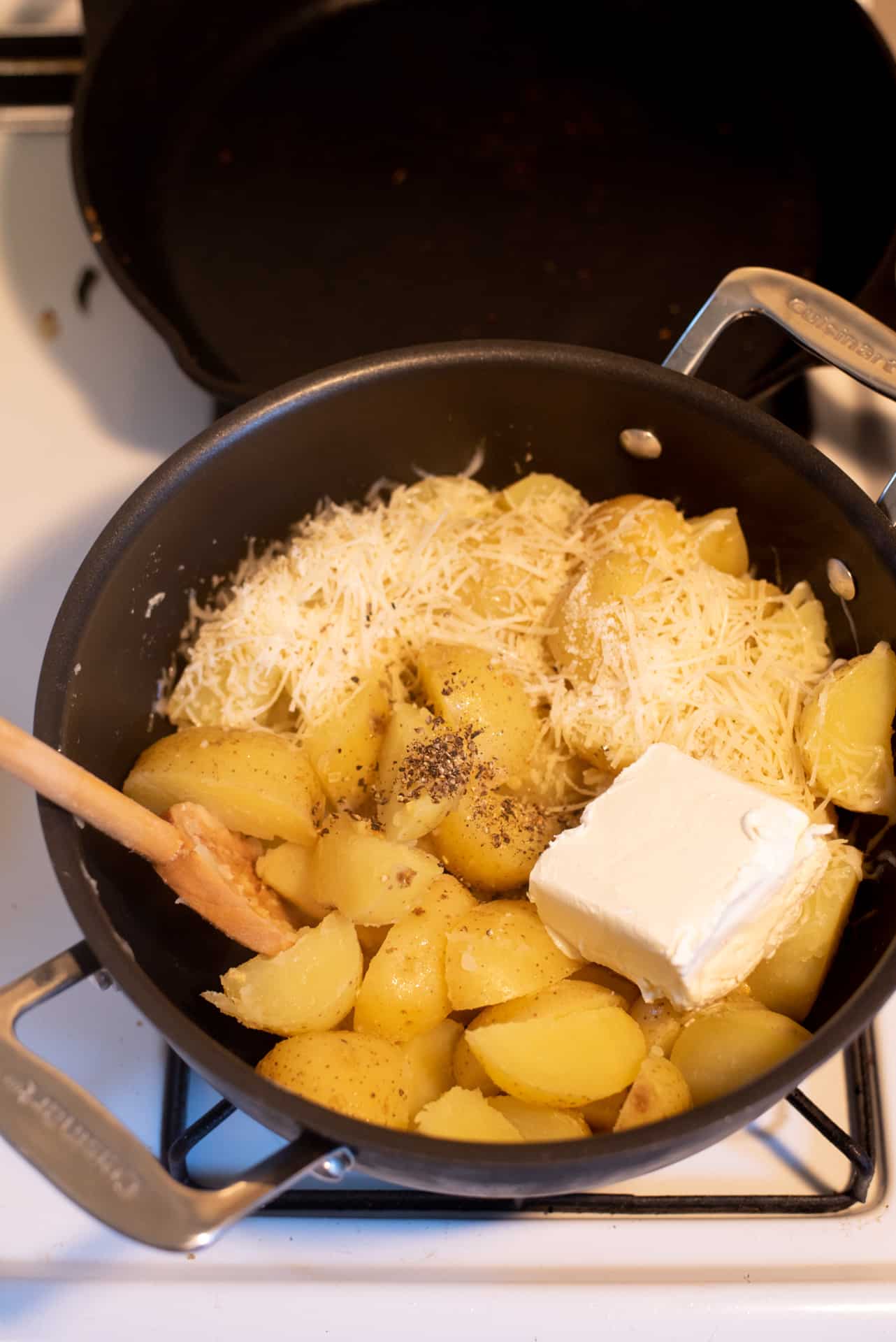 Mashed potato ingredients in a black pot.