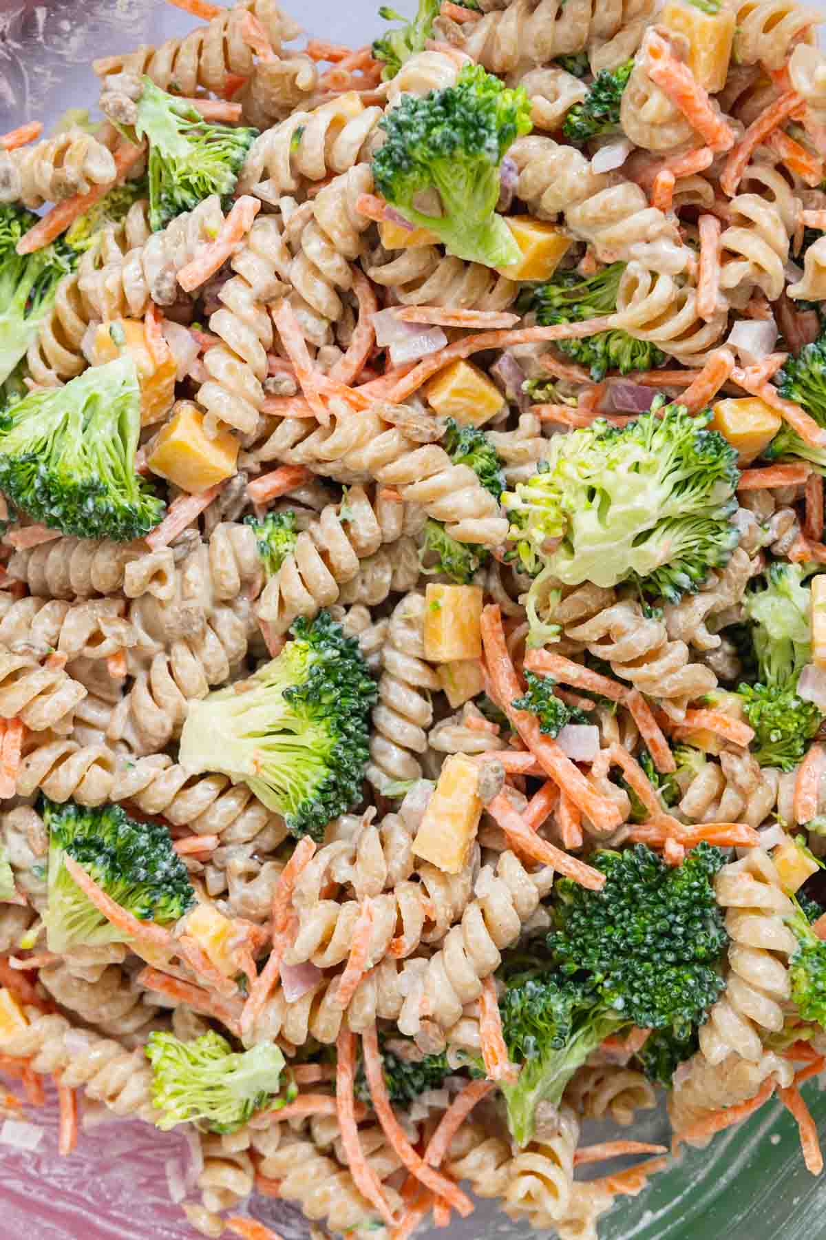 Close up of broccoli cheddar pasta salad with rotini pasta.