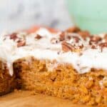 Close up of carrot cake sliced to show the inside texture.