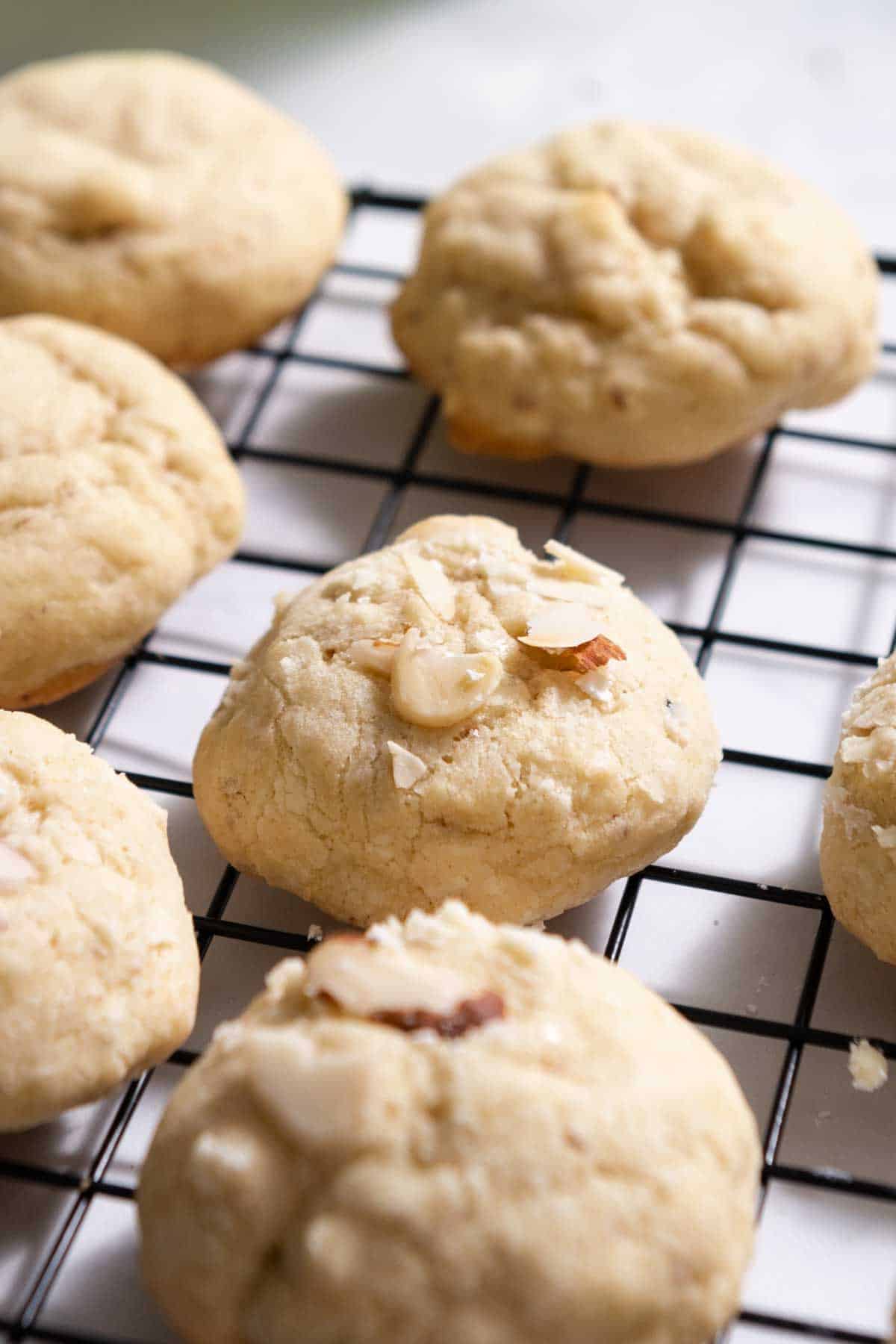 Side view of almond cookies showing puffy texture.