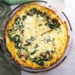 Overhead view of hashbrown quiche in a glass pie dish.