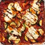 Baked ravioli, ricotta, and zucchini topped with a balsamic drizzle.