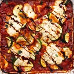 Baked ravioli, ricotta, and zucchini topped with a balsamic drizzle.