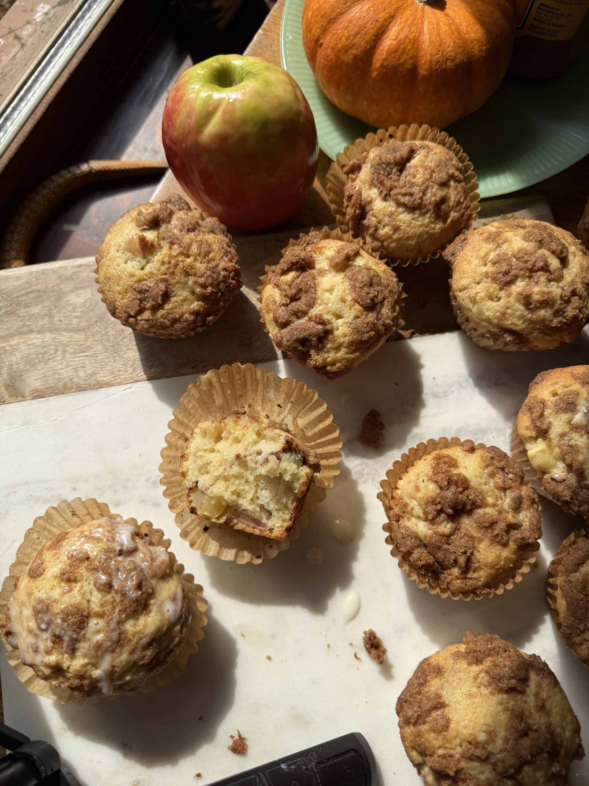 Overhead view of coffee cake muffins in bright sunlight.