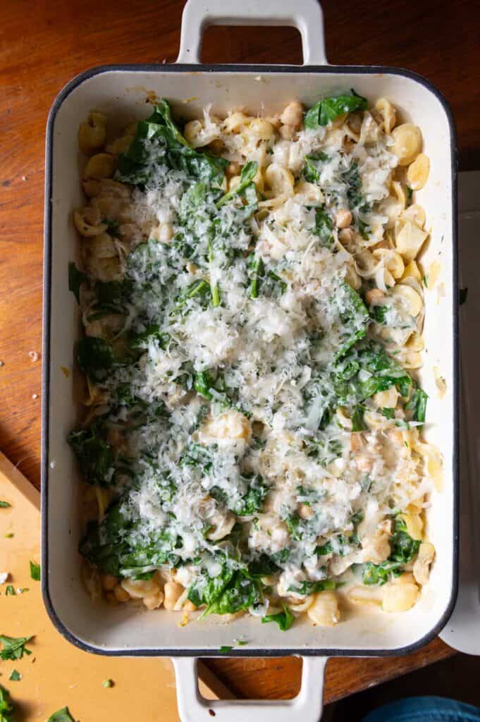 Overhead view of spinach feta bake with melted Parmesan on top.